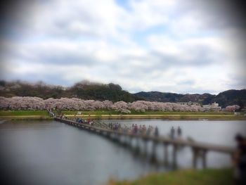 Scenic view of lake against cloudy sky