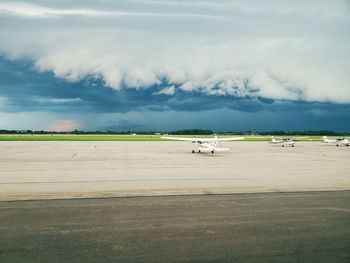 Scenic view of airport runway against sky