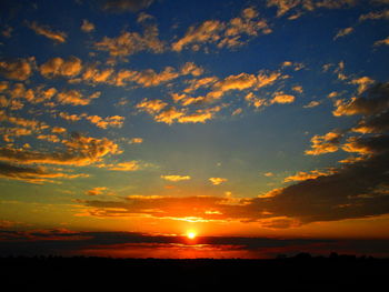 Scenic view of dramatic sky during sunset