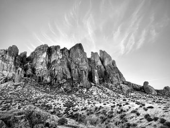 Rock formations on landscape against sky