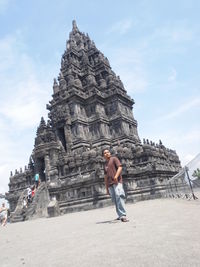 Full length of man standing against temple