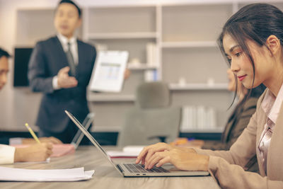 Businesswoman working at table