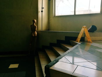 Man standing on staircase of building