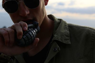 Close-up of man holding grenade