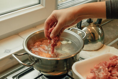 Cooking breakfast beef soup with variety of vegetables at the kitchen in the morning.