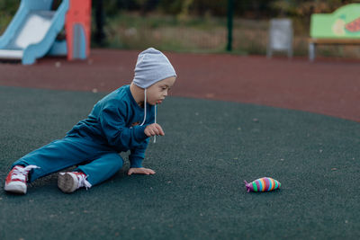 Boy playing soccer on field