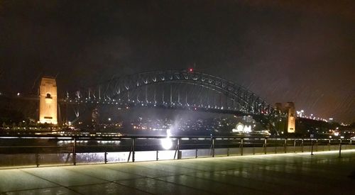 Bridge in city at night