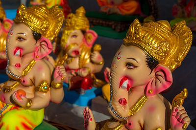 Close-up of ganesha statues at workshop