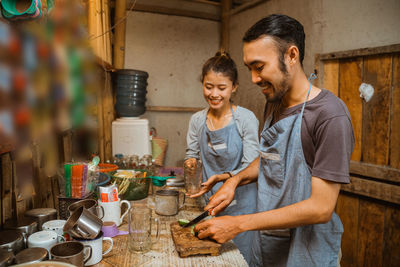 Portrait of man preparing food at home