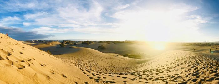 Panoramic view of desert against sky