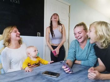 Happy mother and daughter at home
