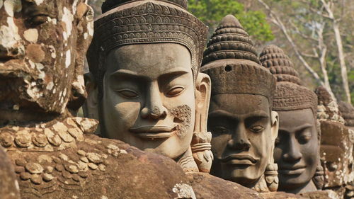 Close-up of buddha statue against temple