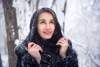 Portrait of a beautiful young woman in winter