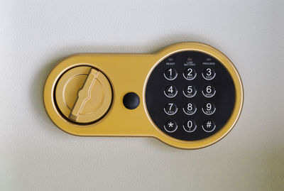 Close-up of telephone on white background