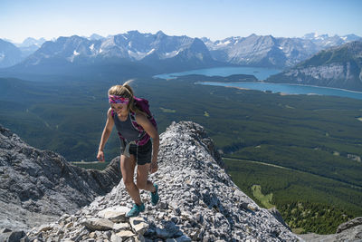 Female hiker high above kananaskis country in alberta