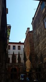 Low angle view of buildings against clear sky