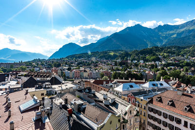 High angle view of houses in town against sky