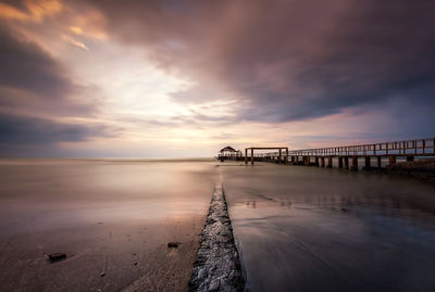 Scenic view of calm sea at sunset