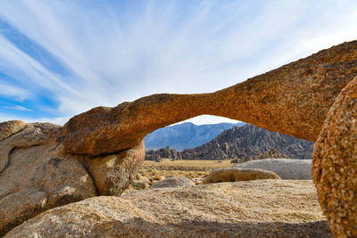 Rock formation on land against sky