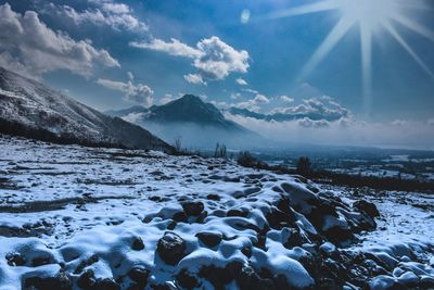 Scenic view of snowcapped mountains against sky