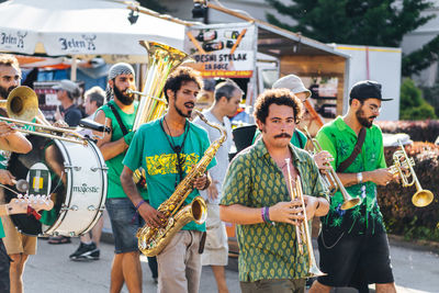 Group of people playing guitar in city