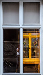 Reflection of building on glass window