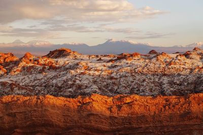 Close-up of orange mountains against sky