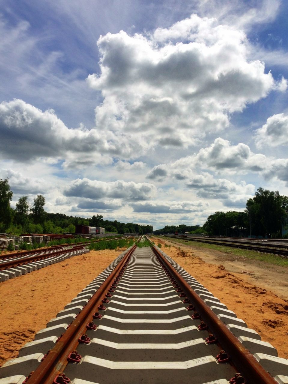 the way forward, railroad track, diminishing perspective, vanishing point, transportation, sky, cloud - sky, rail transportation, cloudy, cloud, tree, landscape, day, straight, nature, road, no people, tranquility, outdoors, railway track