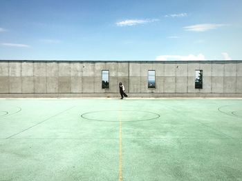 Woman standing in playing field