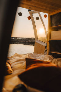 Interior of motor home at lakeshore during sunset