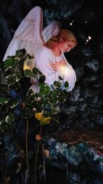 High angle view of woman by flowering plants