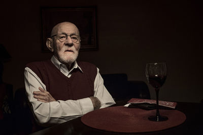 Portrait of man sitting at table