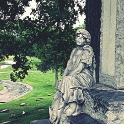 Statue of woman in park