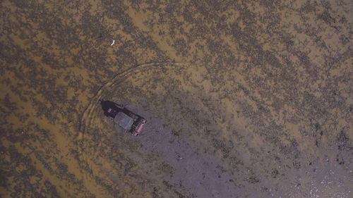 High angle view of abandoned car on beach