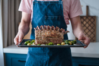 Midsection of man preparing food