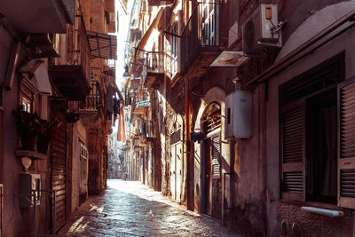 Alley amidst buildings in city