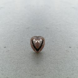 Close-up of heart shape on metal