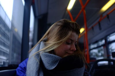 Young woman traveling in bus