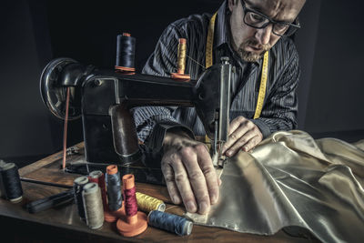 Man using sewing machine