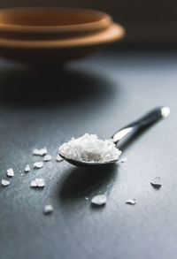 Close-up of salt on table