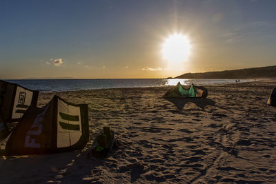 Scenic view of beach against sky during sunset