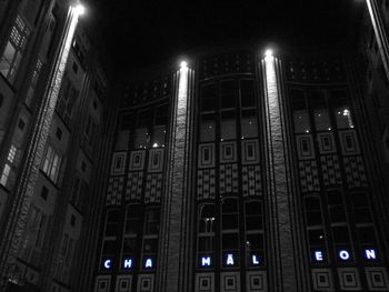 Low angle view of illuminated building at night