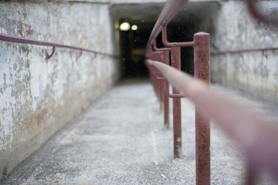 Metallic railing in tunnel during winter