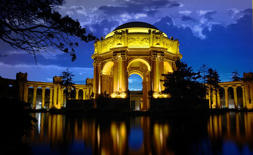 Lake by palacio de bellas artes against sky at dusk