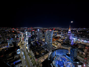 High angle view of illuminated buildings in city at night