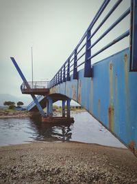 View of bridge over river against sky