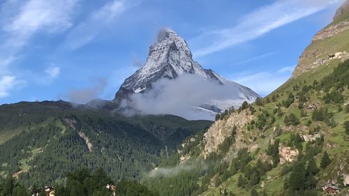 Panoramic view of snowcapped mountains against sky