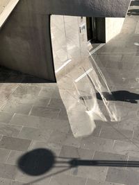 High angle view of shadow on floor in building