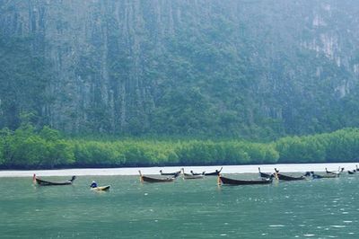 Scenic view of boats in lake