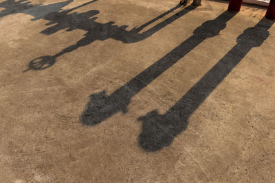 Shadow of machinery on footpath